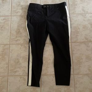 Black dress pants with white side stripe.